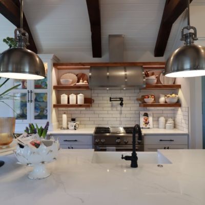 bright Lawrence, KS, kitchen remodel with white stone counters and white backsplashes
