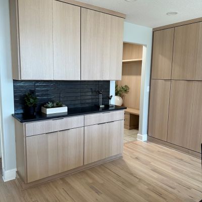 wood cabinets in a Lawrence KS kitchen remodel with black tile backsplash