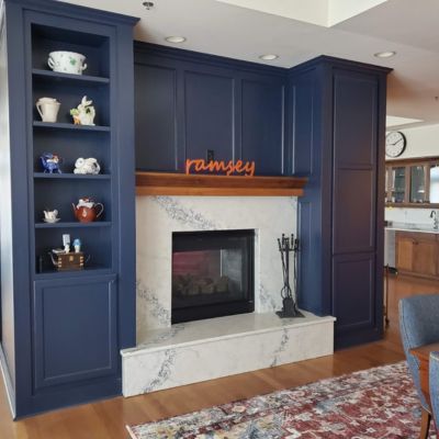kitchen dining room fireplace and blue cabinetry